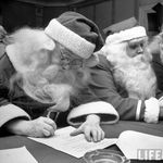 Santa Clauses take a written examinationn for diploma after listening to lectures. October 1948.